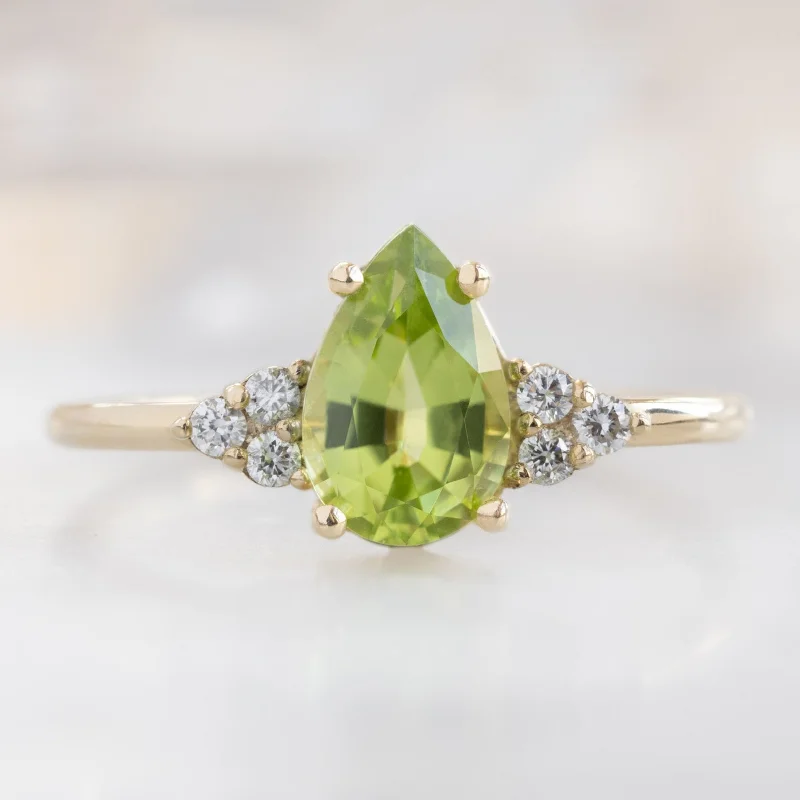 three-stone diamond engagement rings for women-The Ivy Ring | 0.83ct Pear Peridot in 14K Yellow Gold