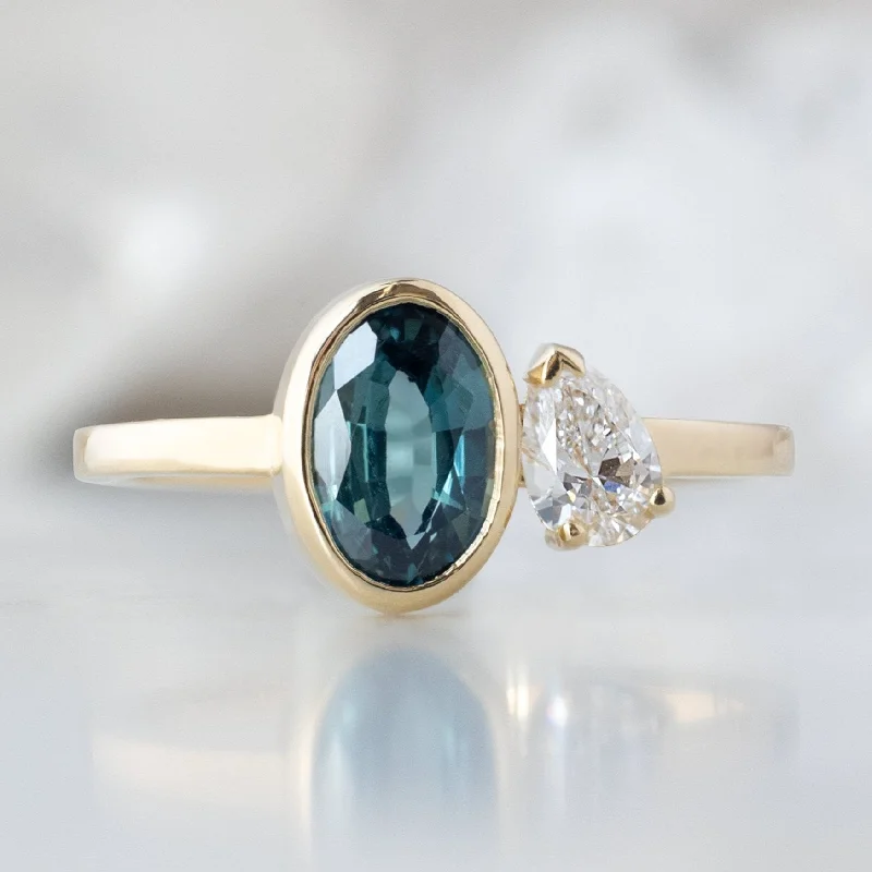 engagement rings with radiant diamonds and emerald bands-The You and Me Ring | 1.11ct Oval Cut Sapphire in 14K Yellow Gold