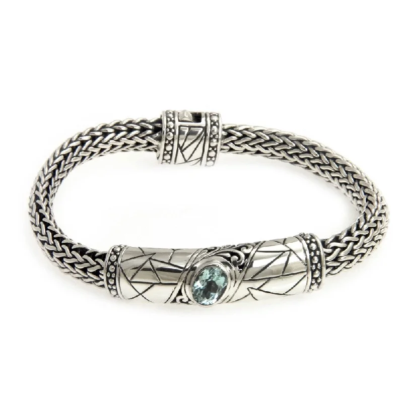 festive charm bangles for women-Women's Sterling Silver 'Meditate' Blue Topaz Bracelet